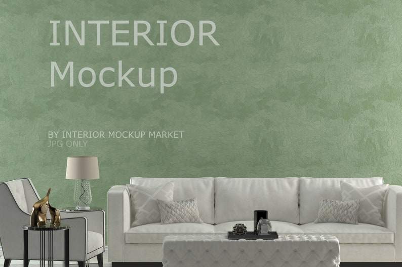 May include: Interior mockup featuring a white sofa, armchair, and ottoman. A decorative lamp and gold elephant statue sit on a side table. The background is a textured green wall. Text on the wall reads "INTERIOR Mockup" and "BY INTERIOR MOCKUP MARKET JPG ONLY."