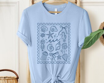 Coquette Seashell T-Shirt,Coastal Summer T-Shirt,Beachy Shell Swim T-Shirt,Trendy Shellfish Best Friend Gift,Ocean Bow TShirt,Ocean Girl Tee