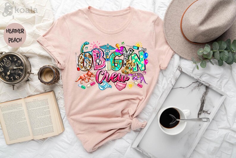 a t - shirt with the word vegan on it next to a cup of