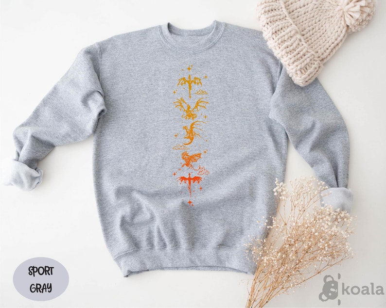 a gray sweater with a yellow and orange design on it