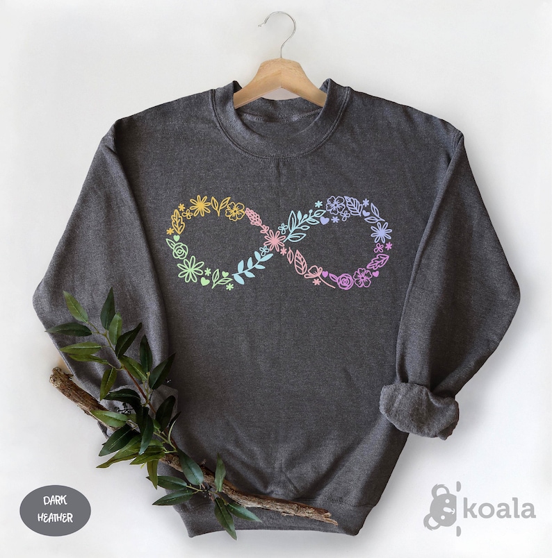 May include: Dark heather grey sweatshirt with an infinity symbol made of flowers and leaves in pastel colors.