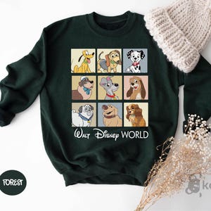 a green sweatshirt with a picture of dogs on it