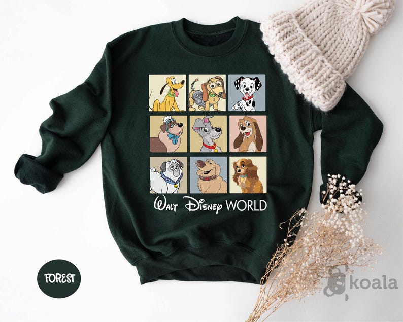a green sweatshirt with a picture of dogs on it