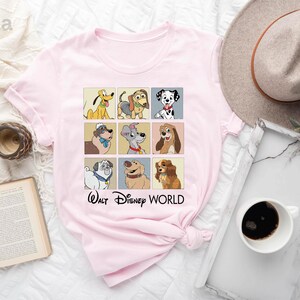 a pink shirt with a picture of dogs on it