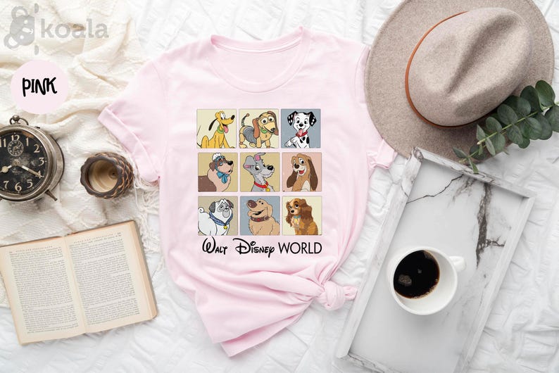 a pink shirt with a picture of dogs on it