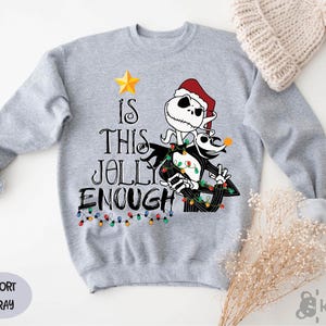 a gray sweater with a skeleton wearing a santa hat