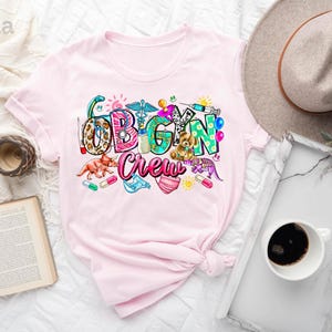 a pink shirt with the word vegan crew on it