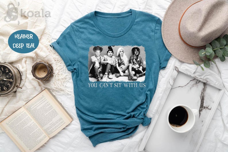 a t - shirt that says you can't sit with us