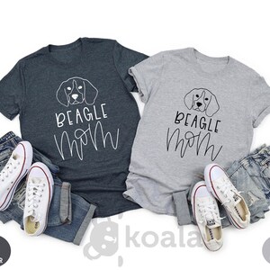 May include: Two t-shirts, one dark heather grey and one light grey, with a beagle silhouette and the text "Beagle Mom" in white.