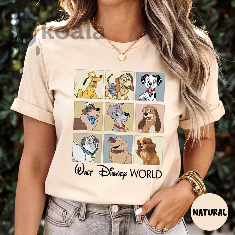 a woman wearing a t - shirt with dogs on it