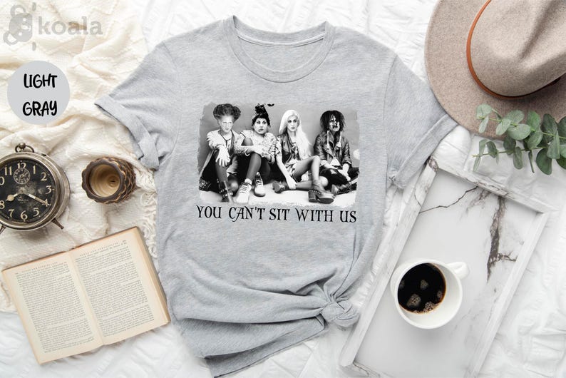 a t - shirt that says you can't sit with us