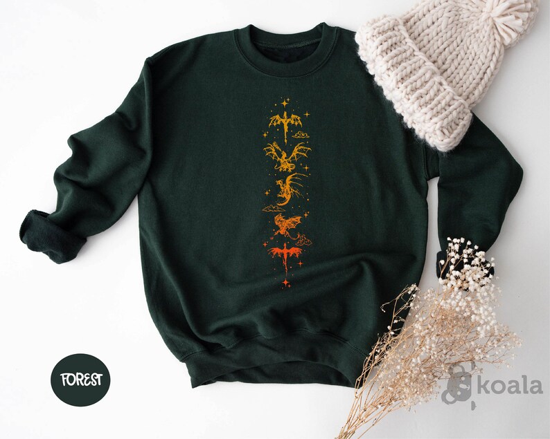 a green sweatshirt with a yellow dragon on it