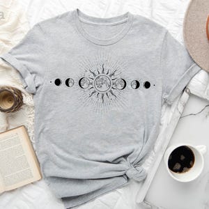 a t - shirt with the phases of the moon on it