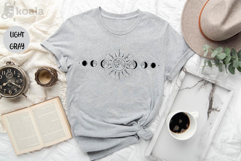 a t - shirt with the phases of the moon on it