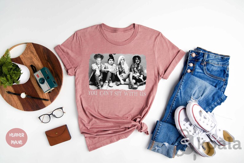 a t - shirt with a picture of three women on it