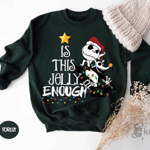 a green sweater with a santa clause on it