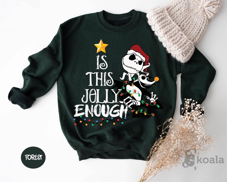 a green sweater with a santa clause on it