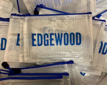 May include: A collection of clear, white mesh zipper pouches with blue trim and the word "EDGEWOOD" printed in blue. The pouches have a blue zipper and a black pull.