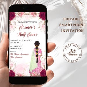 May include: Smartphone invitation for a Half Saree event. The design features floral accents, a watercolor illustration of a woman in a saree, and event details. The text reads "You are invited to Saanvi's Half Saree". The invitation is editable.