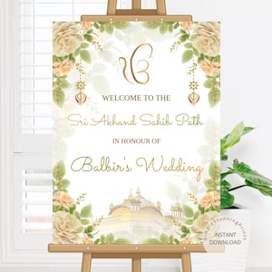 Pode incluir: Uma placa de boas-vindas retangular num cavalete de madeira com um símbolo Ik Onkar dourado, bordas florais com rosas creme e folhas verdes, e o texto Welcome to the Sri Akhand Sahib Path in honour of Balbir's Wedding sobre um templo dourado.