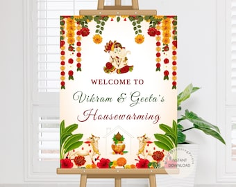 May include: Welcome to Vikram & Geeta's Housewarming sign with a floral garland border, a depiction of Ganesha, and a cow with a bell around its neck.