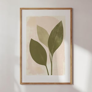 May include: A framed print with a minimalist design featuring three green leaves on a light pink background.