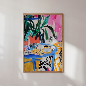 May include: A colorful abstract painting of a table with a cup of coffee on it, surrounded by plants and a patterned tablecloth. The painting is done in a loose, expressive style with bright colors and bold lines.