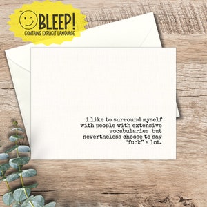 May include: A white greeting card with a matching envelope, featuring the text "i like to surround myself with people with extensive vocabularies but nevertheless choose to say "fuck" a lot." A yellow sticker with the word "BLEEP!" and a smiley face is in the upper left corner.