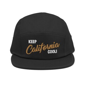 May include: Black 5-panel cap with a white embroidered "KEEP CALIFORNIA COOL!" text in a brown cursive font.