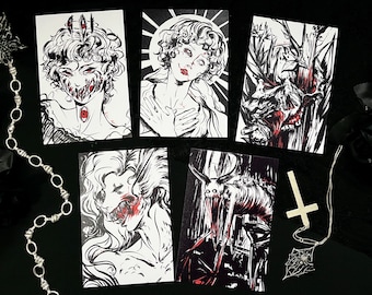 May include: A collection of five black and white art prints with red accents, depicting gothic and horror-themed illustrations. A silver chain, a cross pendant, and a spiderweb pendant are also present.