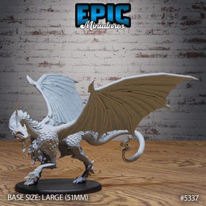 May include: A white dragon miniature with wings spread wide. The dragon has a long, slender body with a small head and a long tail. The miniature is made of a white plastic material and is approximately 51mm in size. The miniature is posed in a dynamic stance, with its wings spread wide and its head tilted slightly to the side. The miniature is a great addition to any tabletop game or collection.
