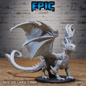 May include: A detailed, unpainted miniature dragon figurine with large wings, a long tail, and spiky features. The base size is large, measuring 51mm. The Epic Miniatures logo is visible in the top center.