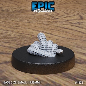 May include: A small, gray, segmented, curled creature on a black base. The creature is about 1.9 inches in diameter. The base is labeled "#4475" and "BASE SIZE: SMALL (19.13MM)".