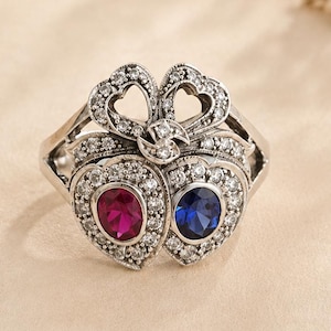 Bague victorienne double cœur – Argent sterling, rubis et saphir, motif nœud