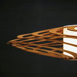 Eco-friendly wooden chandelier with natural plywood layers. Minimalist pendant light for Nordic and Japandi-inspired interiors. Stylish and unique ceiling lighting fixture for modern spaces.