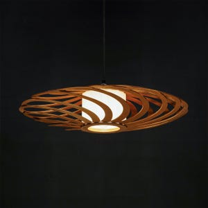 Handmade wooden pendant light with a unique laser-cut plywood design. Modern Scandinavian ceiling lamp for cozy interiors. Eco-friendly and stylish chandelier for dining room, bedroom, or living space.