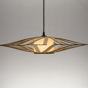 Handcrafted mid-century wooden ceiling light featuring an open-frame structure. A statement piece for dining rooms, bedrooms, or modern living spaces.