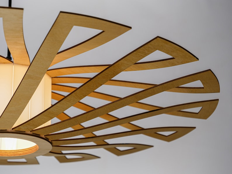 Scandinavian-inspired wooden chandelier with a radial sunburst pattern. A perfect blend of minimalist and mid-century modern lighting for stylish home decor.