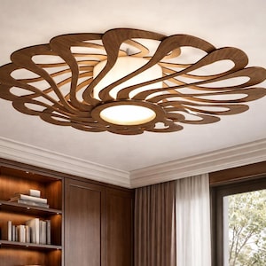 Może przedstawiać: Nowoczesna lampa sufitowa o unikalnym designie. Oprawa posiada okrągłą drewnianą ramę z wirującym, ażurowym wzorem w kolorze ciemnobrązowym. Środek ma białe, cylindryczne źródło światła o jasnej, ciepłej poświacie.