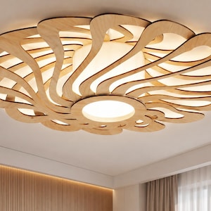 May include: A wooden ceiling light fixture with a floral design. The fixture is made of light-colored wood and features a series of curved, petal-like shapes that surround a central light source. The design is modern and decorative.