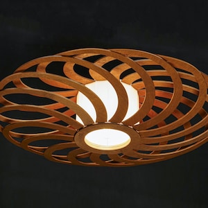 Minimalist wood pendant lamp with organic shapes. Mid Century Natural plywood chandelier with warm ambient lighting. Perfect for Japandi, Nordic, or modern interiors. Ideal eco-friendly lighting solution for homes, cafes, and studios.