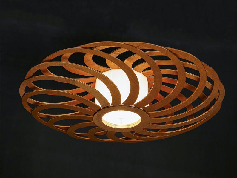Minimalist wood pendant lamp with organic shapes. Mid Century Natural plywood chandelier with warm ambient lighting. Perfect for Japandi, Nordic, or modern interiors. Ideal eco-friendly lighting solution for homes, cafes, and studios.