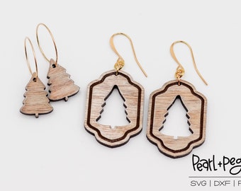 May include: Three pairs of wooden Christmas tree earrings. The first pair is a simple tree shape, the second pair is a tree shape with a decorative frame, and the third pair is the same as the second pair. All earrings have gold hooks.