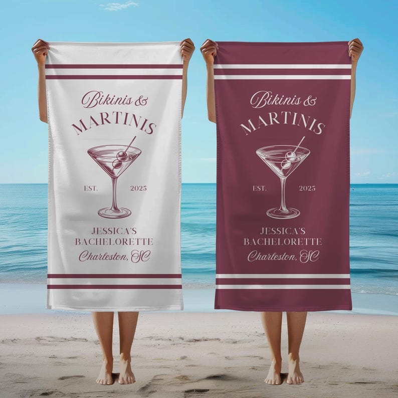 May include: Two white beach towels with maroon stripes and text. The text reads "Bikinis & Martinis" with a martini glass graphic and "EST. 2025 Jessica's Bachelorette Charleston, SC".