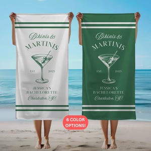 May include: Two white beach towels with green text and a green martini glass graphic. The text reads "Bikinis & Martinis" and "Jessica's Bachelorette Charleston, SC".