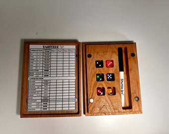 May include: A wooden Yahtzee game set with a scorecard and a dice tray. The dice tray has five dice and a black marker labeled "Shuttle Art".