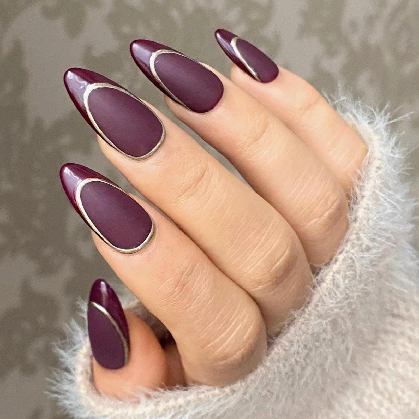 Marble-Patterned Maroon Nails Trend