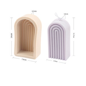 May include: Two silicone moulds for making arch-shaped candles. The mould on the left is beige and measures 7.8 cm wide, 14 cm tall, and 4.3 cm deep. The mould on the right is lavender and measures 5.9 cm wide, 11.7 cm tall, and 3.8 cm deep.