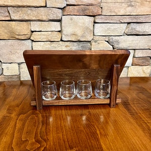 Walnut whiskey shot tray holder is a perfect way to display your shot board when not in use.  The shot glasses sit in routed holes behind your whiskey shot board.  Storage for shot flight board and whiskey shot glasses, perfect gift for home bar.
