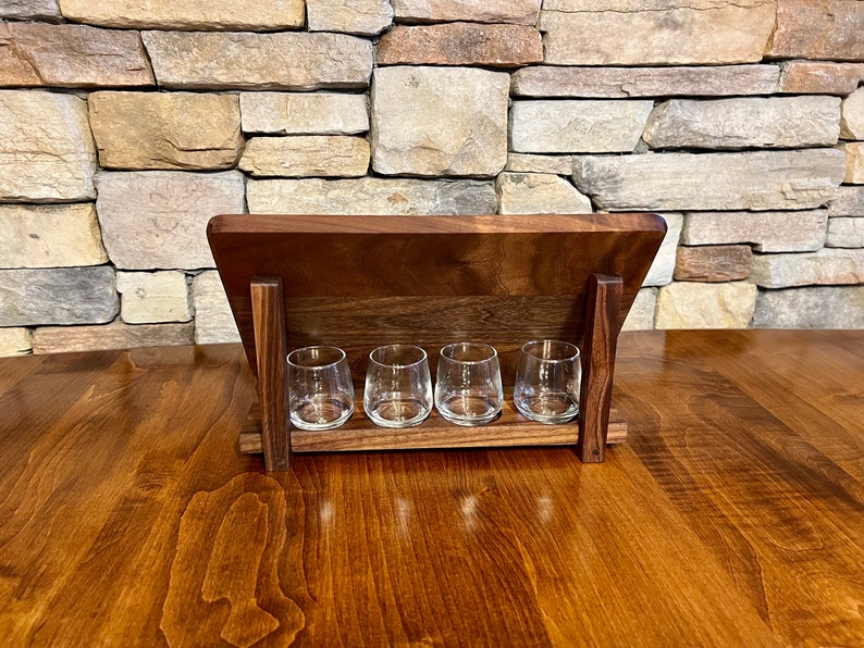 Walnut whiskey shot tray holder is a perfect way to display your shot board when not in use.  The shot glasses sit in routed holes behind your whiskey shot board.  Storage for shot flight board and whiskey shot glasses, perfect gift for home bar.